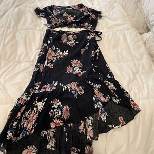 Two-piece high waisted wrap skirt with Tie front top.
